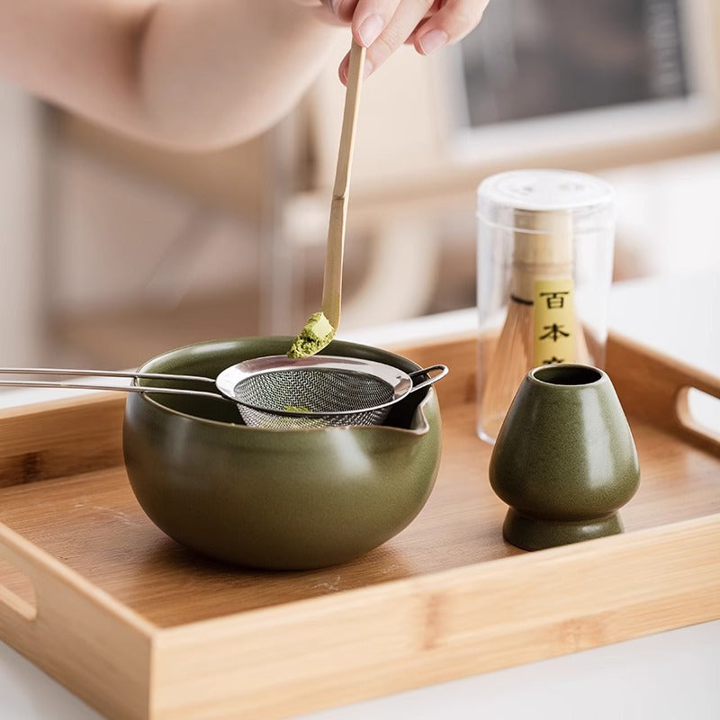 Scooping matcha with the bamboo chashaku