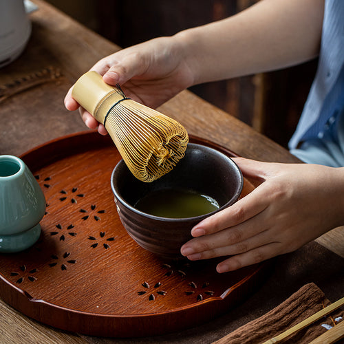 Whisking matcha with the bamboo chasen